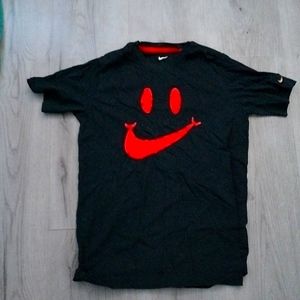 Red smiley face Nike shirt
